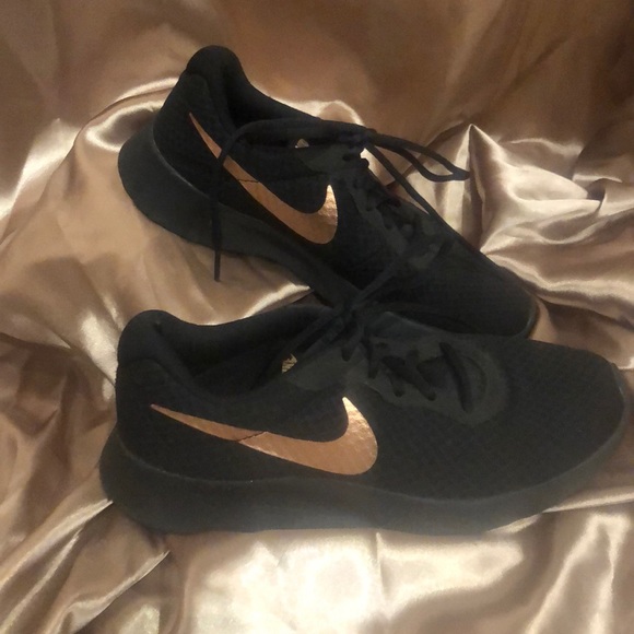 black and rose gold nikes